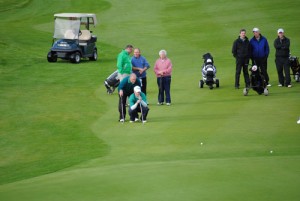 Derek and Jonathon line up the final putts